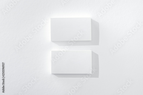 top view of empty cards on white background with copy space