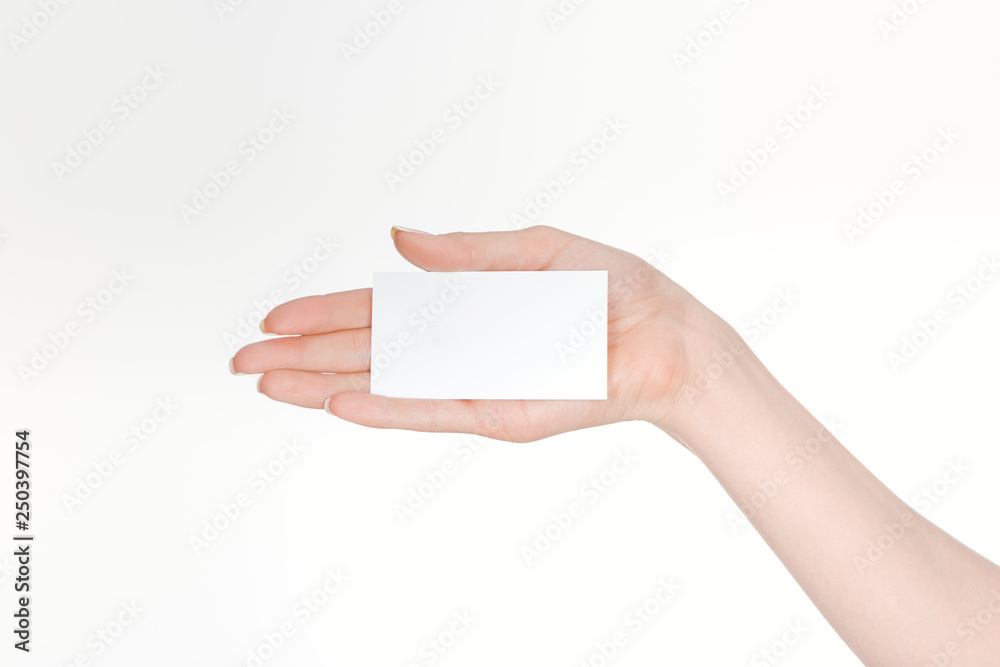 partial view of woman holding blank card isolated on white partial view of woman holding blank card isolated on white
