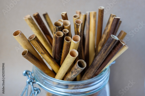 Zero waste reed drinking straws in glass jar photo