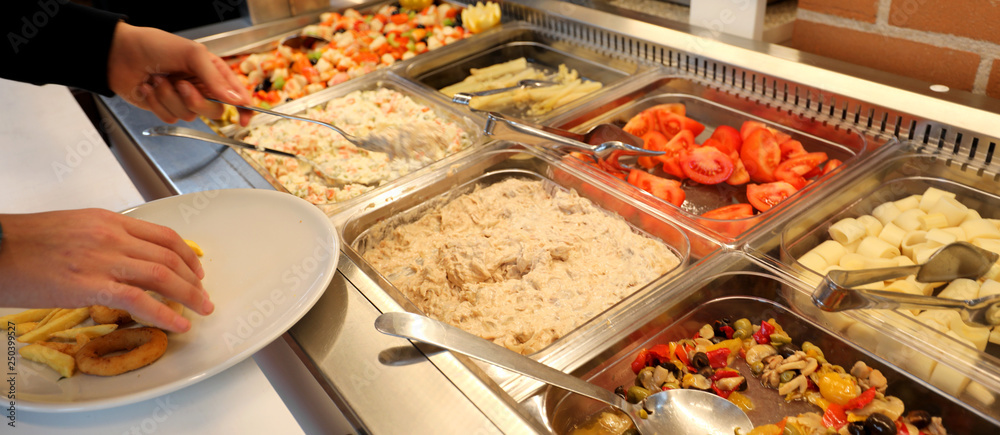 Obraz premium restaurant with many raw and cooked foods