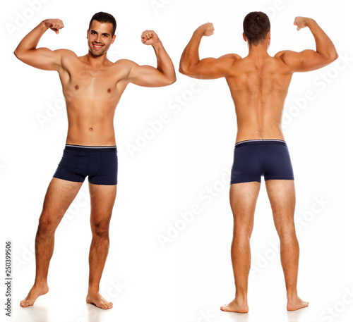 front and back of shirtless handsome man in panties on white background showing his biceps