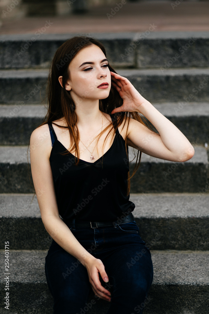 young girl posing on a street in the city