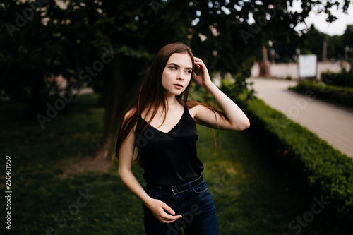 young girl posing on a street in the city