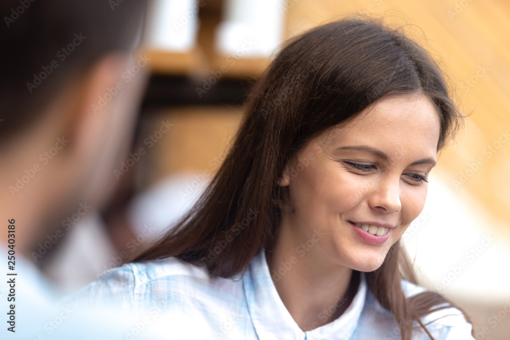 Shy female talking with guy during romantic date Shy female talking with guy during romantic date