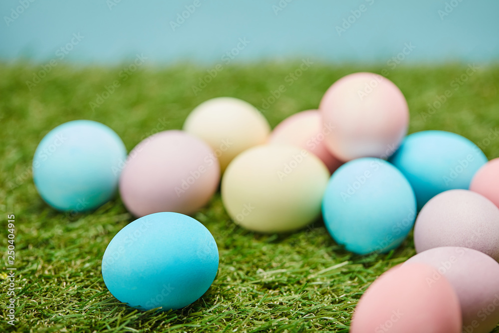 selective focus of easter painted eggs on grass selective focus of easter painted eggs on grass
