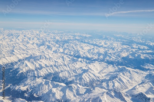 Aerial view of snow covered mountains - snowy mountain peaks - high mountains - Alps