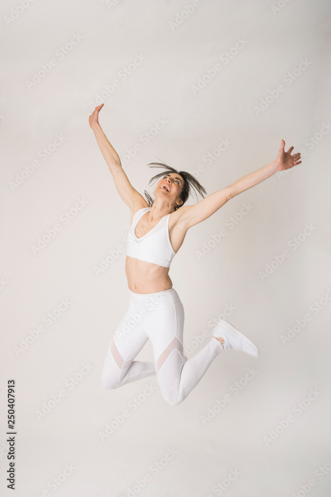 Girl with a sports outfit and white background Girl with a sports outfit and white background
