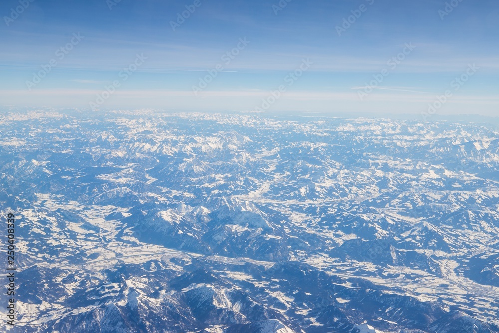 Aerial view of snow covered mountains - snowy mountain peaks - high mountains - Alps