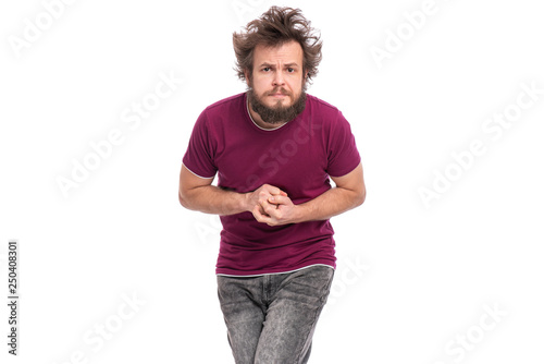 Crazy bearded modest and embarrassed Man with funny Haircut, isolated on white background. He is Shy and looking in camera with doubt. Emotions and signs concept.