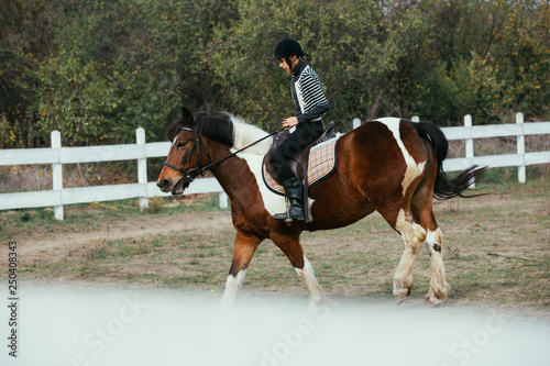 woman riding horse outdoor on polygon