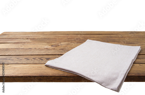 Empty tablecloth on wood table isolated on white background. Selective focus. Place for food. Top view. Mockup and template copy space.