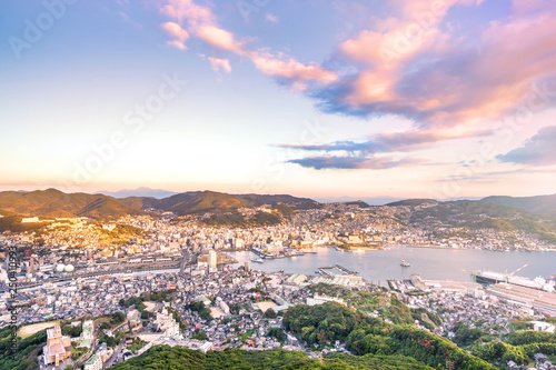 Business concept, modern cityscape of nagasaki dusk from mount inasa, the new top 3 nightview of the world, aerial view, copy space