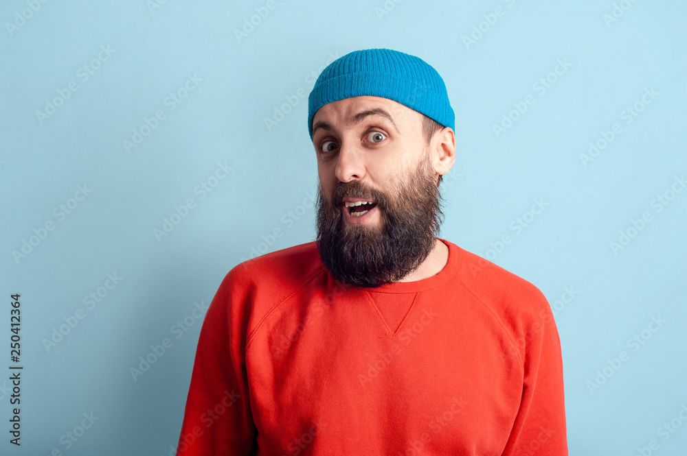 Fototapeta premium Young emotional bearded man and facial expression concept