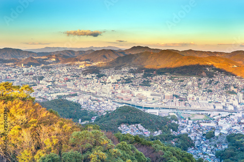 Business concept, modern cityscape of nagasaki dusk from mount inasa, the new top 3 nightview of the world, aerial view, copy space