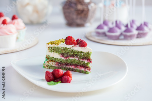 green cake with berries