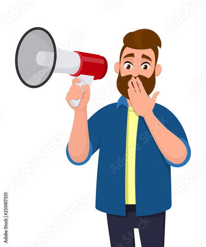 Shocked young man holding a megaphone or loudspeaker and covering or closing his mouth with hand fingers. Human emotion facial expression feeling concept illustration in vector cartoon style.