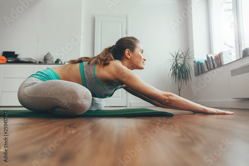 Young woman doing yoga pose in lotus