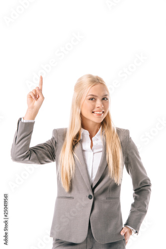 beautiful smiling businesswoman having idea and pointing up, isolated on white