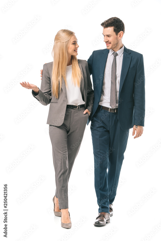 successful smiling businesspeople posing in suits isolated on white successful smiling businesspeople posing in suits isolated on white