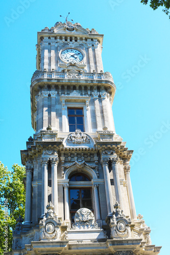The historical clock tower in front of the Dolmabahce Palace.  photo