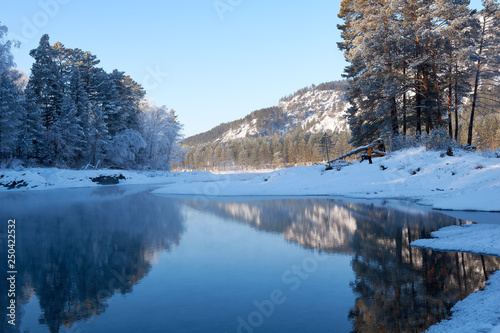 Blue Lake in the Mountain Valley of the Katun River, Chemale region. The Republic of the Mountain Altai. winter view of the lake in the mountains. fantastic nature. Winter fairy l