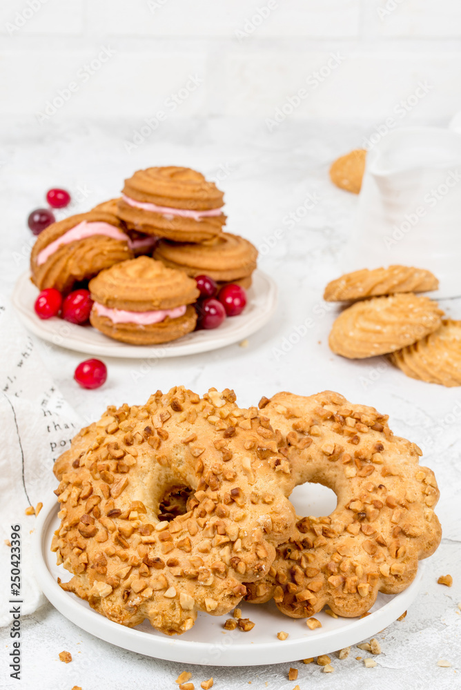 Shortbread, round biscuits with nuts, shot in decor Shortbread, round biscuits with nuts, shot in decor