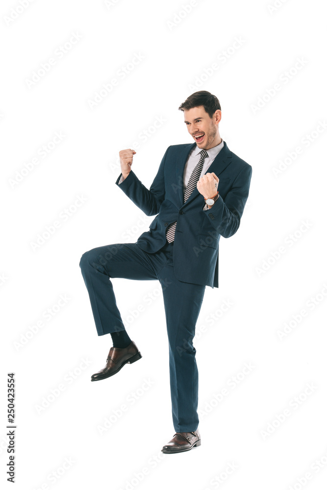 successful businessman in suit celebrating triumph isolated on white