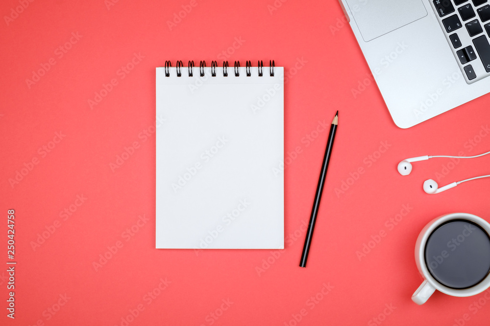 Minimal workplace with laptop and blank notepad Minimal workplace with laptop and blank notepad