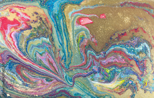 Multicolored gold marbling pattern. Golden marble liquid texture.