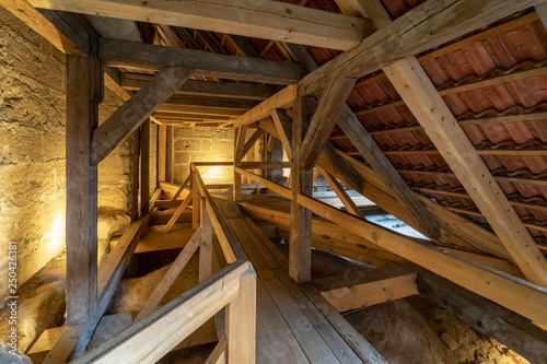 Wooden structures (rafters and beams) of the attic of an old house.