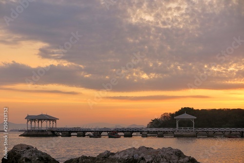 Beautiful sunrise at Asadang Bridge, Koh Sichang Island,Chonburi, Thailand. © Natchaya