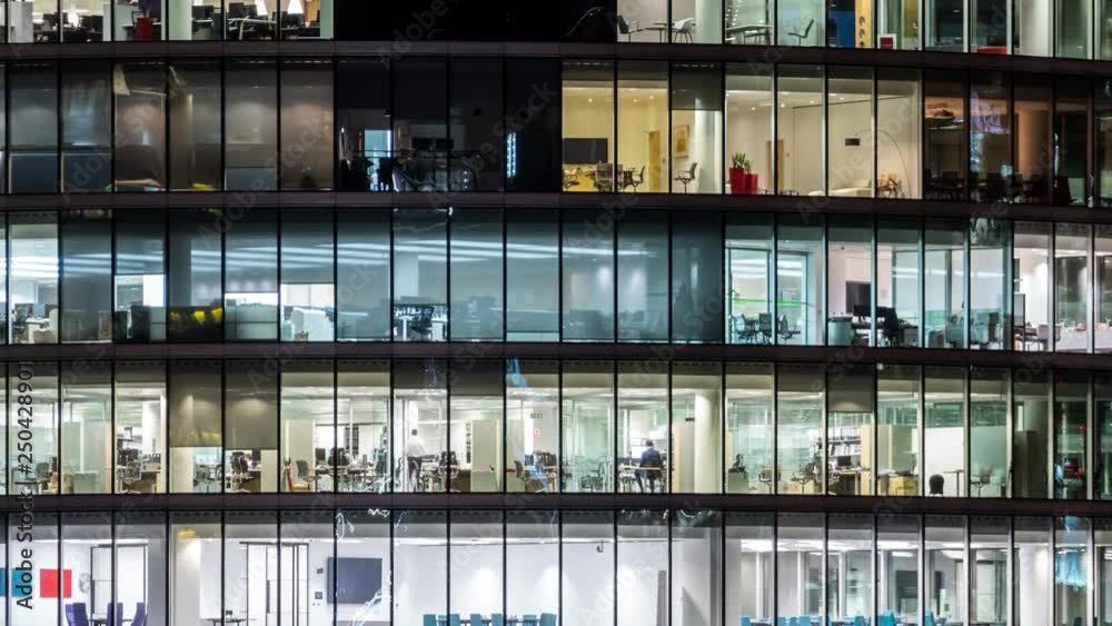 Night time Close up View Office Windows Business Center London City UK Time lapse