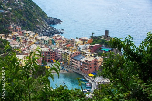 Beautiful small town of Vernazza in the Cinque Terre national Park. View on Vernazza Castello Doria the old fortress and tower at the coastal hill of town Vernazza. Italian colorful landscapes.