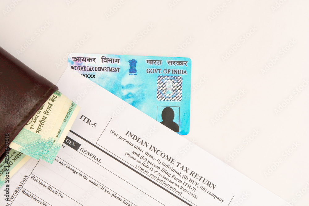 New Indian ITR-5 Income tax Form with indian currency and PAN or Permanent Account Number on isolated background New Indian ITR-5 Income tax Form with indian currency and PAN or Permanent Account Number on isolated background
