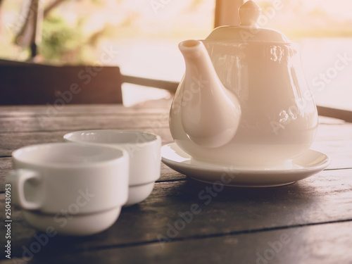 Hot tea serving on wood table background with soft light morning