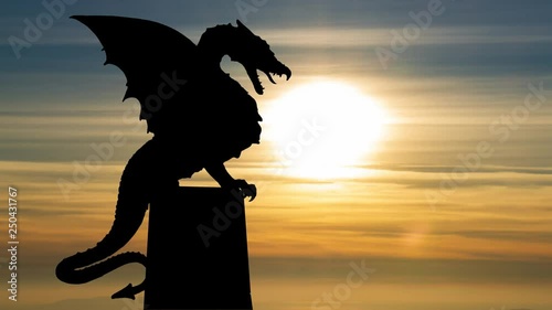 Dragon statue on the bridge in Ljubljana (Zmajski most), capital of Slovenia, at Sunset photo