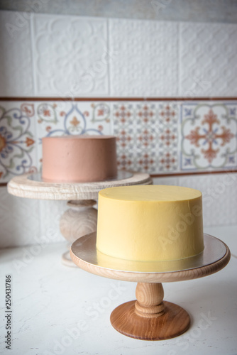 Naked wedding birthday cake. Rustic layer homemade cake with cream. Dessert decorated with chocolate and fruits. Selective focus. Piece of cake. Vegan raw cake.