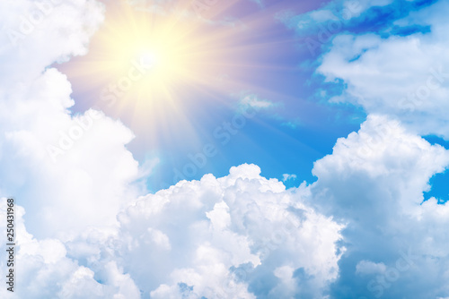 Blue sky with white clouds and sun. Sky background