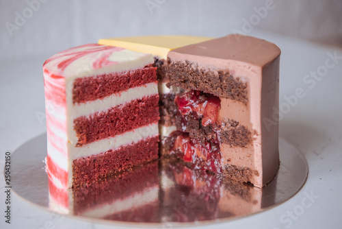Naked wedding birthday cake. Rustic layer homemade cake with cream. Dessert decorated with chocolate and fruits. Selective focus. Piece of cake. Vegan raw cake.