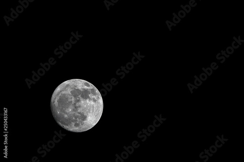 Dark black sky and full moo...