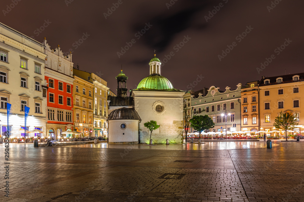 Naklejka premium Church of St. Adalbert or Church of St. Wojciech at night in Krakow, Poland