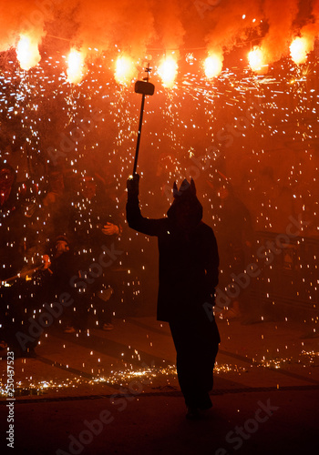 A devil dancing with fire during a 