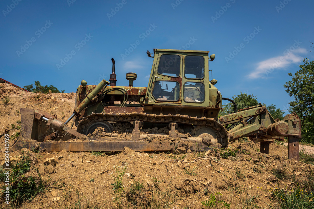 Old military bulldozer with Continuous Track drive