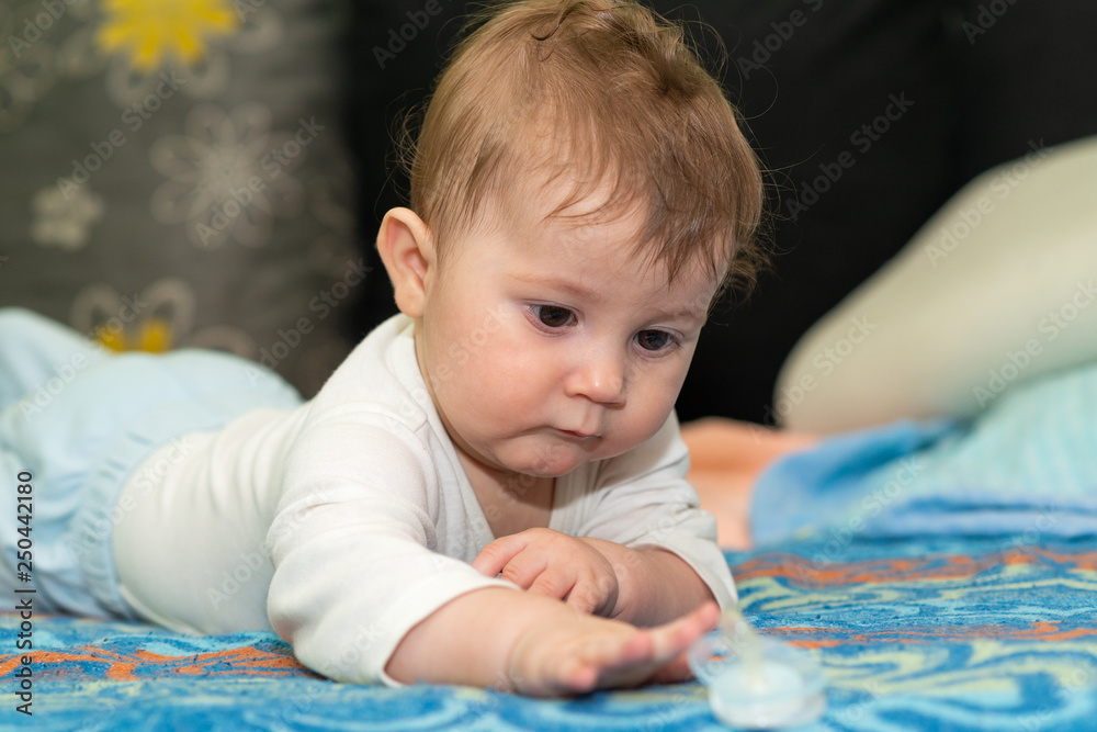 Baby crawling towards a pacifer Baby crawling towards a pacifer