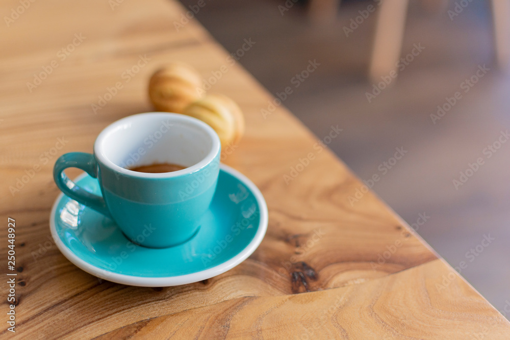 Coffee cup close up morning cafe view. Coffee concept. Wooden texture background. Wood material. Roasted Italian espresso. Place for text. Natural vintage shop with coffee and cappuccino Coffee cup close up morning cafe view. Coffee concept. Wooden texture background. Wood material. Roasted Italian espresso. Place for text. Natural vintage shop with coffee and cappuccino