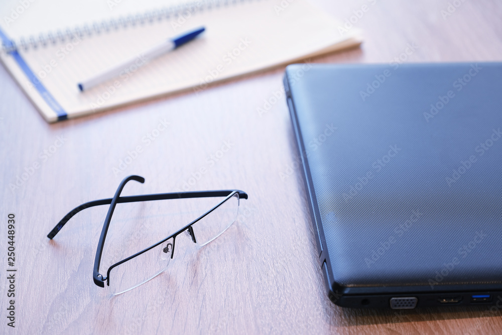Tablet computer red case stand for tablet a great accessory. A detailed notebook and glasses. For work. Tablet computer red case stand for tablet a great accessory. A detailed notebook and glasses. For work.