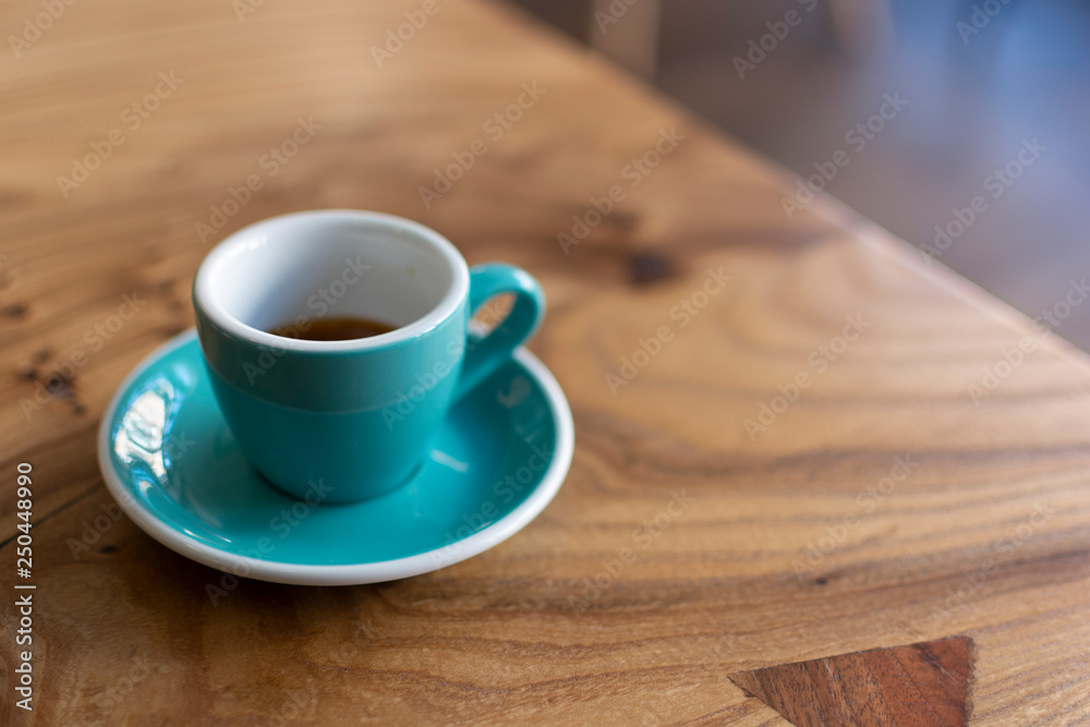 Coffee cup close up morning cafe view. Coffee concept. Wooden texture background. Wood material. Roasted Italian espresso. Place for text. Natural vintage shop with coffee and cappuccino Coffee cup close up morning cafe view. Coffee concept. Wooden texture background. Wood material. Roasted Italian espresso. Place for text. Natural vintage shop with coffee and cappuccino