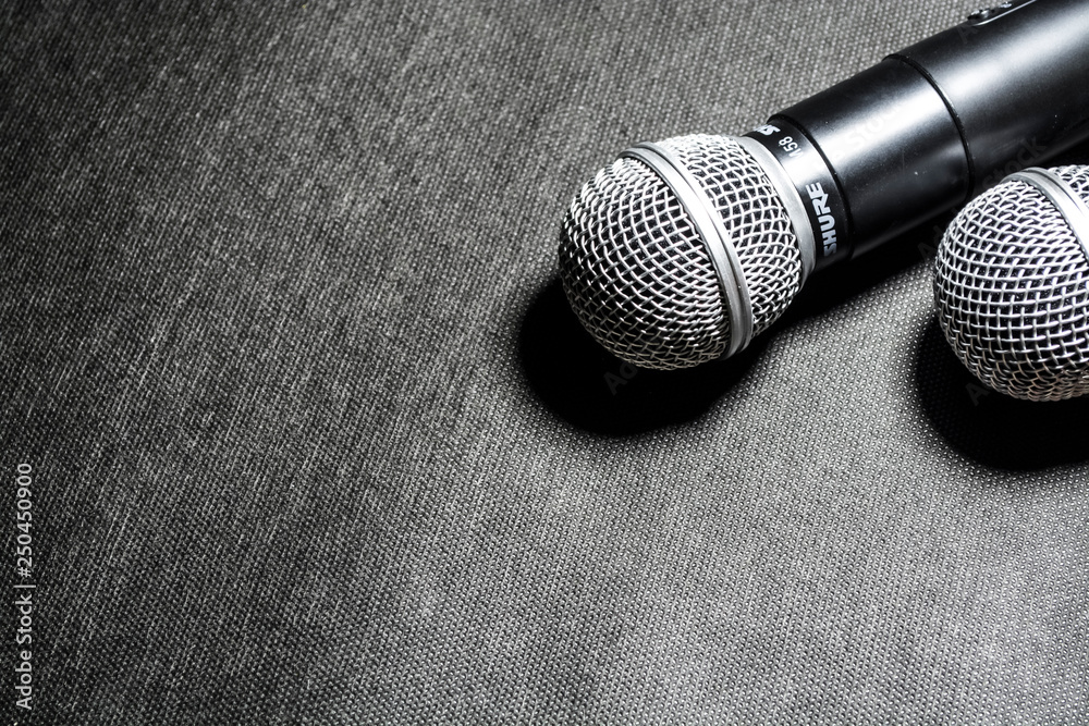 Kiev, Ukraine. January 10, 2019. The microphone for singing on black background lies. Karaoke. Modern technologies. Music. Gadgets