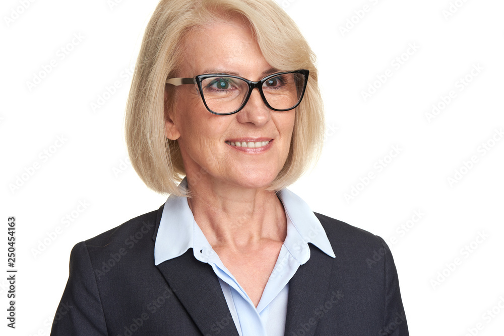 Mature woman in suit wearing glasses