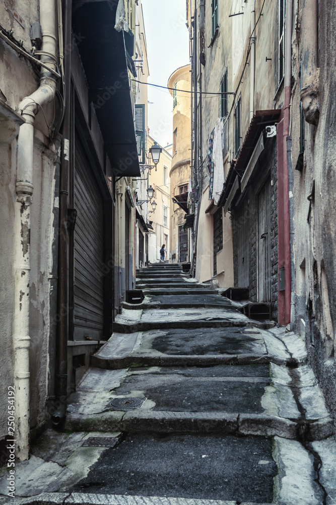 Fototapeta premium Impression of the narrow street Via Saccheri in the center of the Italian town San Remo